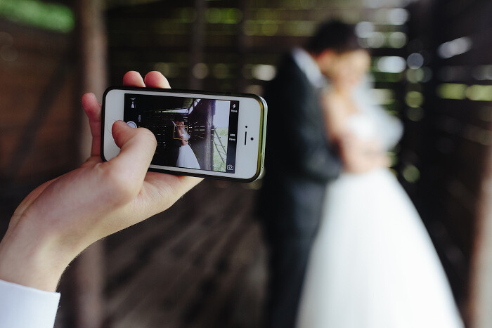 close-up-mobile-taking-photo-newlyweds700.jpg