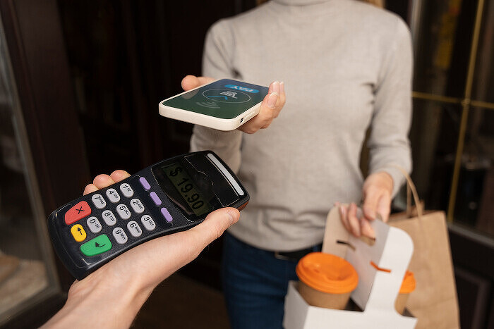 person-paying-using-nfc-technology700.jpg